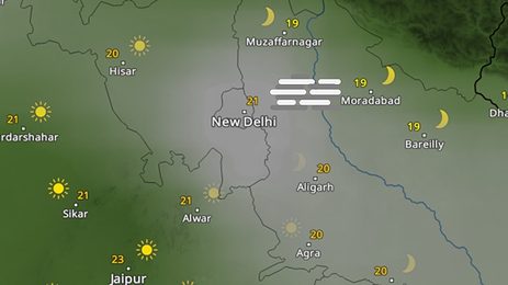 Weather forecast map of northern India showing fog over New Delhi and nearby areas, with sun icons elsewhere and temperature labels around cities such as Hisar, Agra, Jaipur, and Muzaffarnagar.